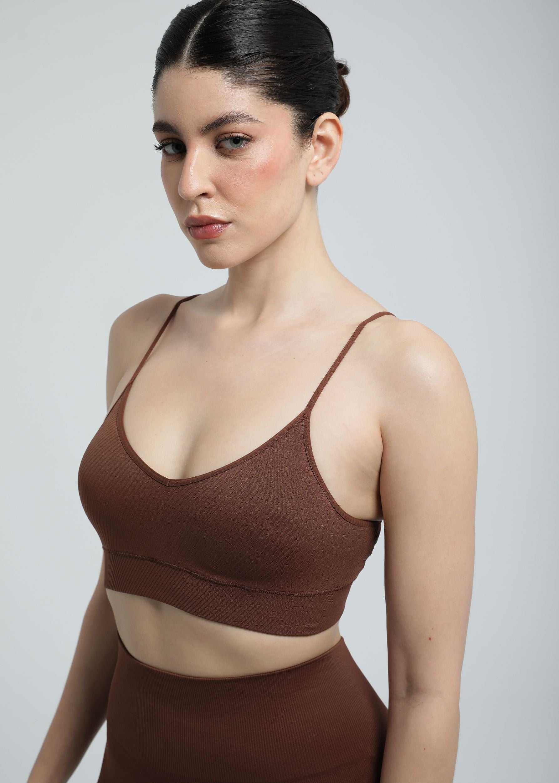 Model wearing Second Skin Essential Sculpting Bralette in cocoa brown, front studio view
