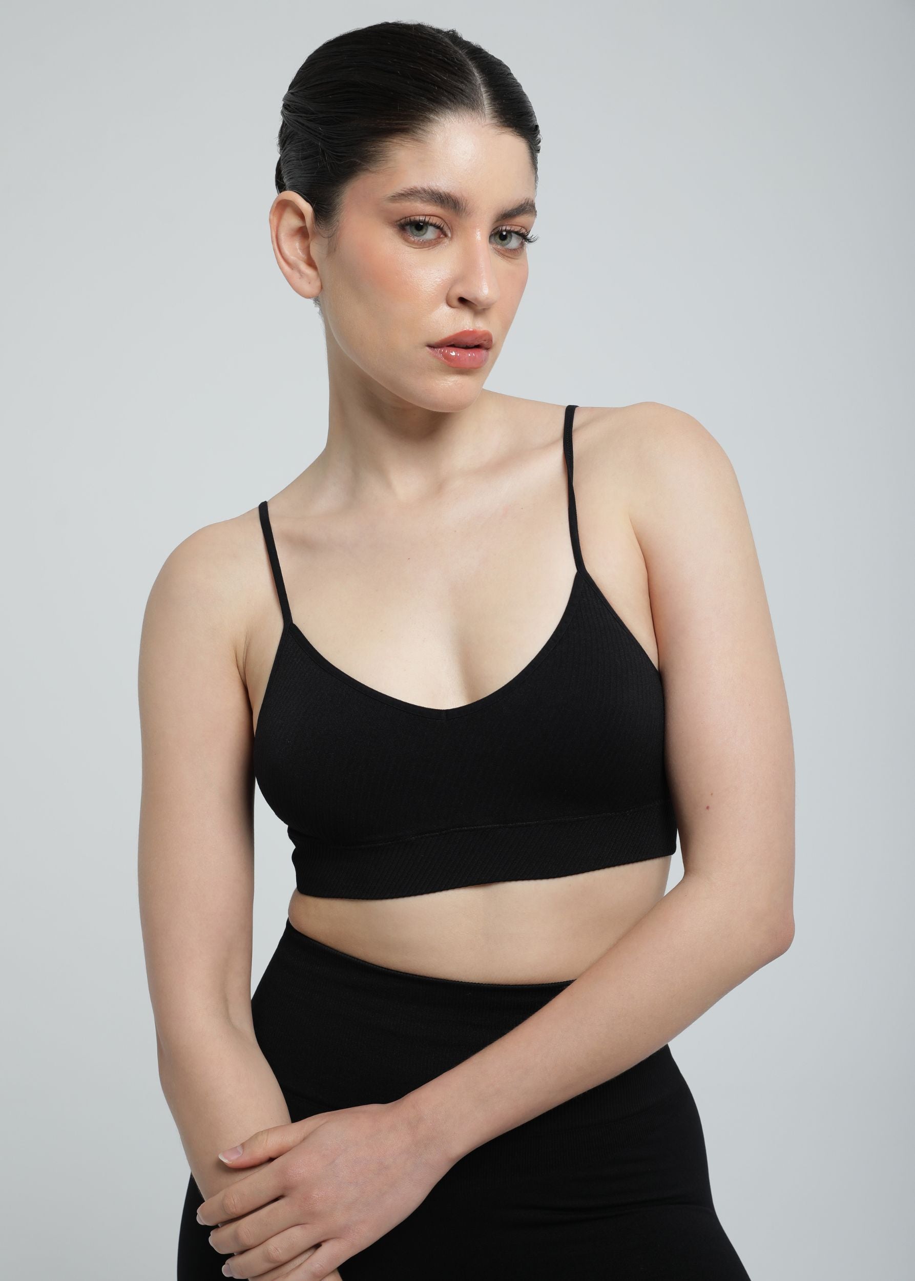 Model wearing Second Skin Essential Sculpting Bralette in black, front studio view