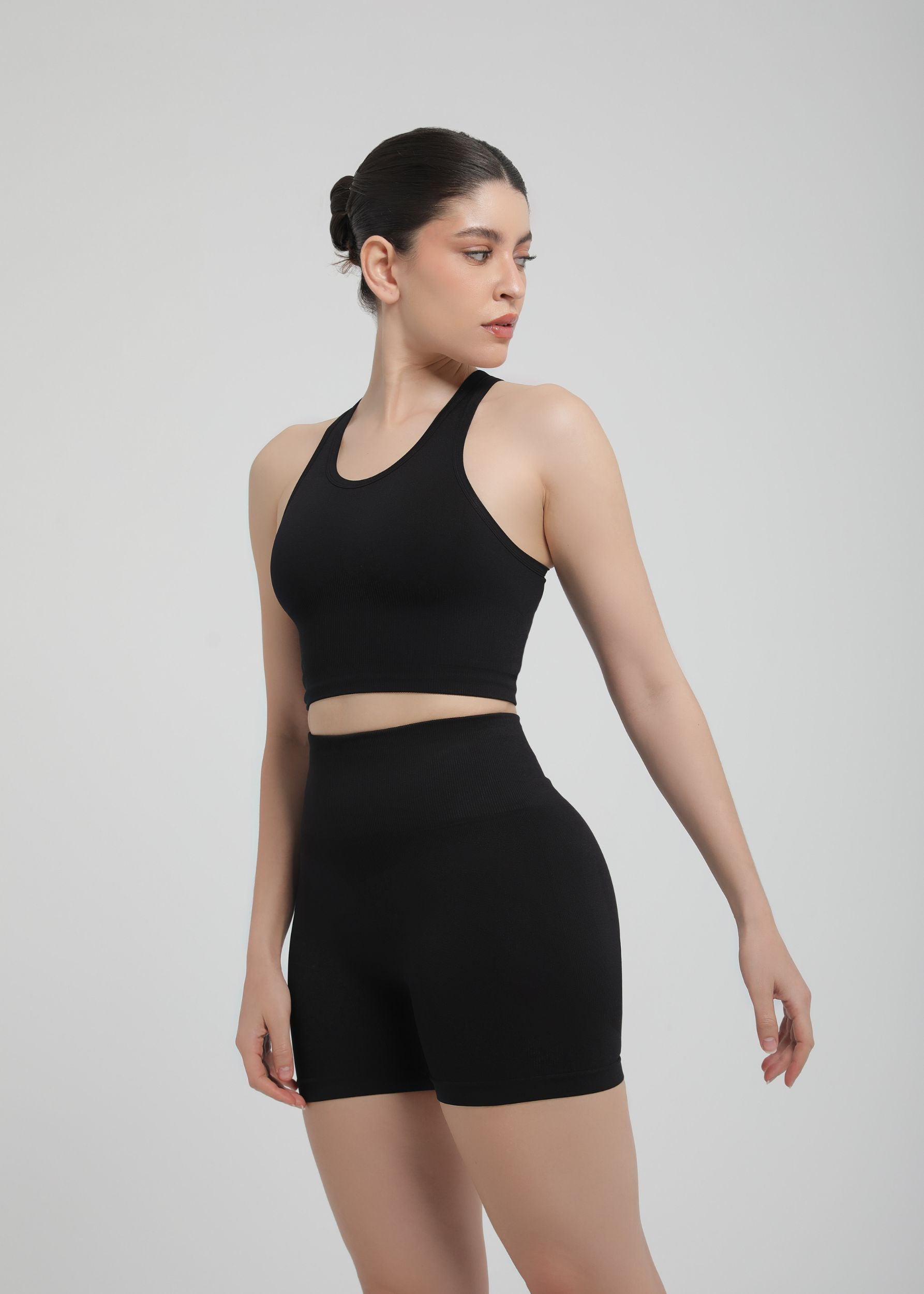 Black high-waist sculpting shorts with seamless compression, front view