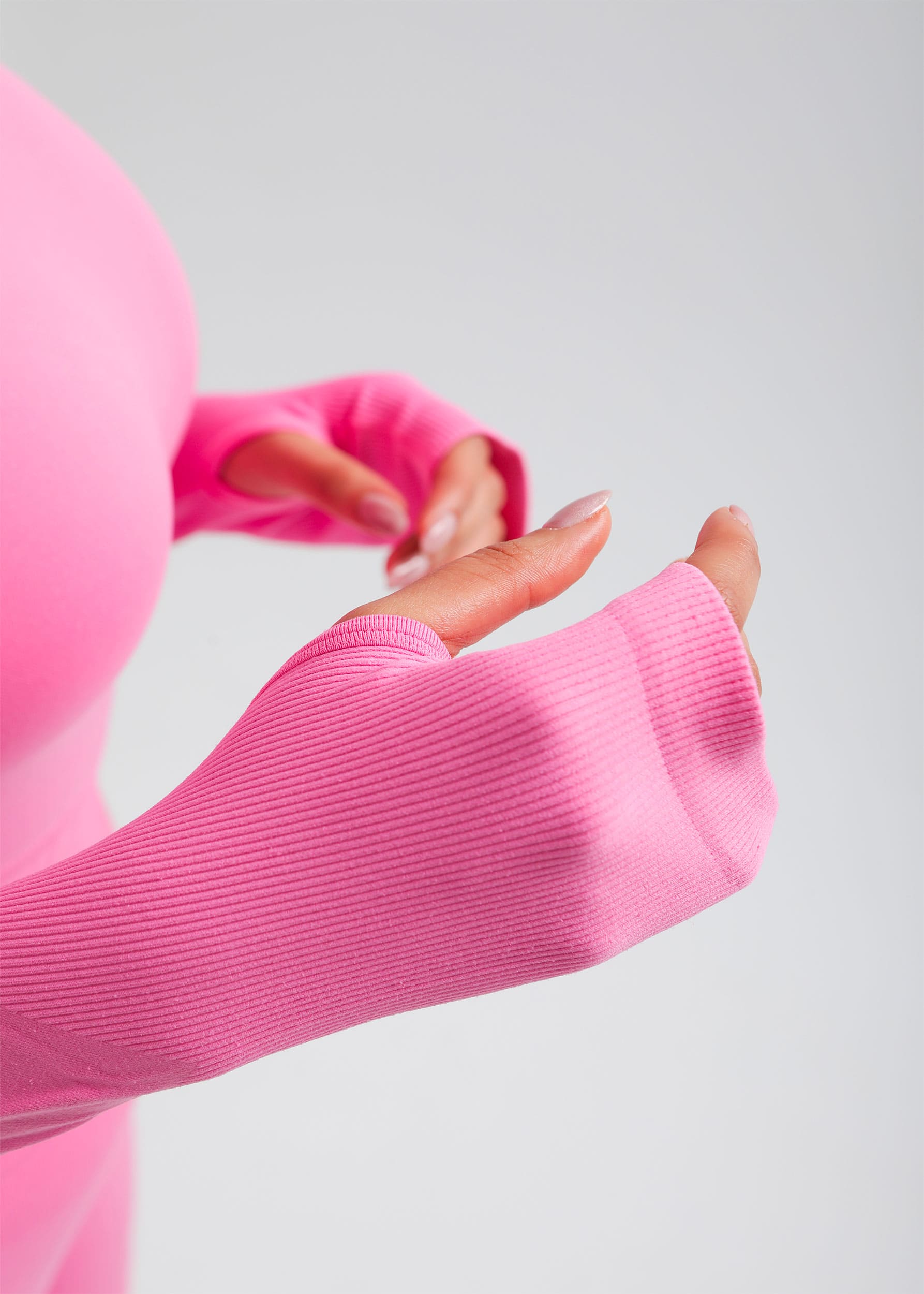 Second Skin long sleeve sculpting crop top in Rose Pink, close-up of sleeve cuff and fabric detail