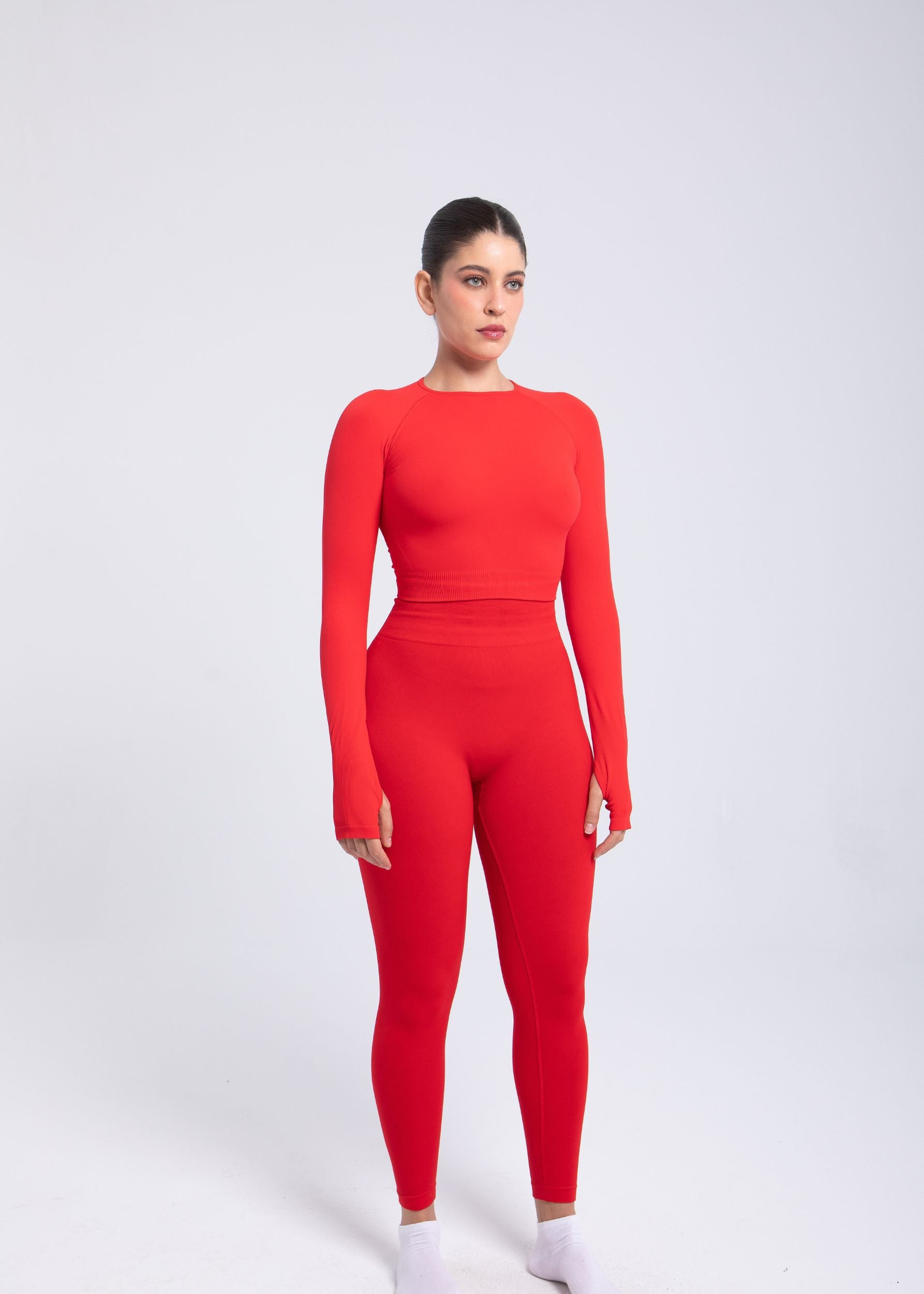 Second Skin long sleeve sculpting crop top in True Red, full body styling with matching leggings