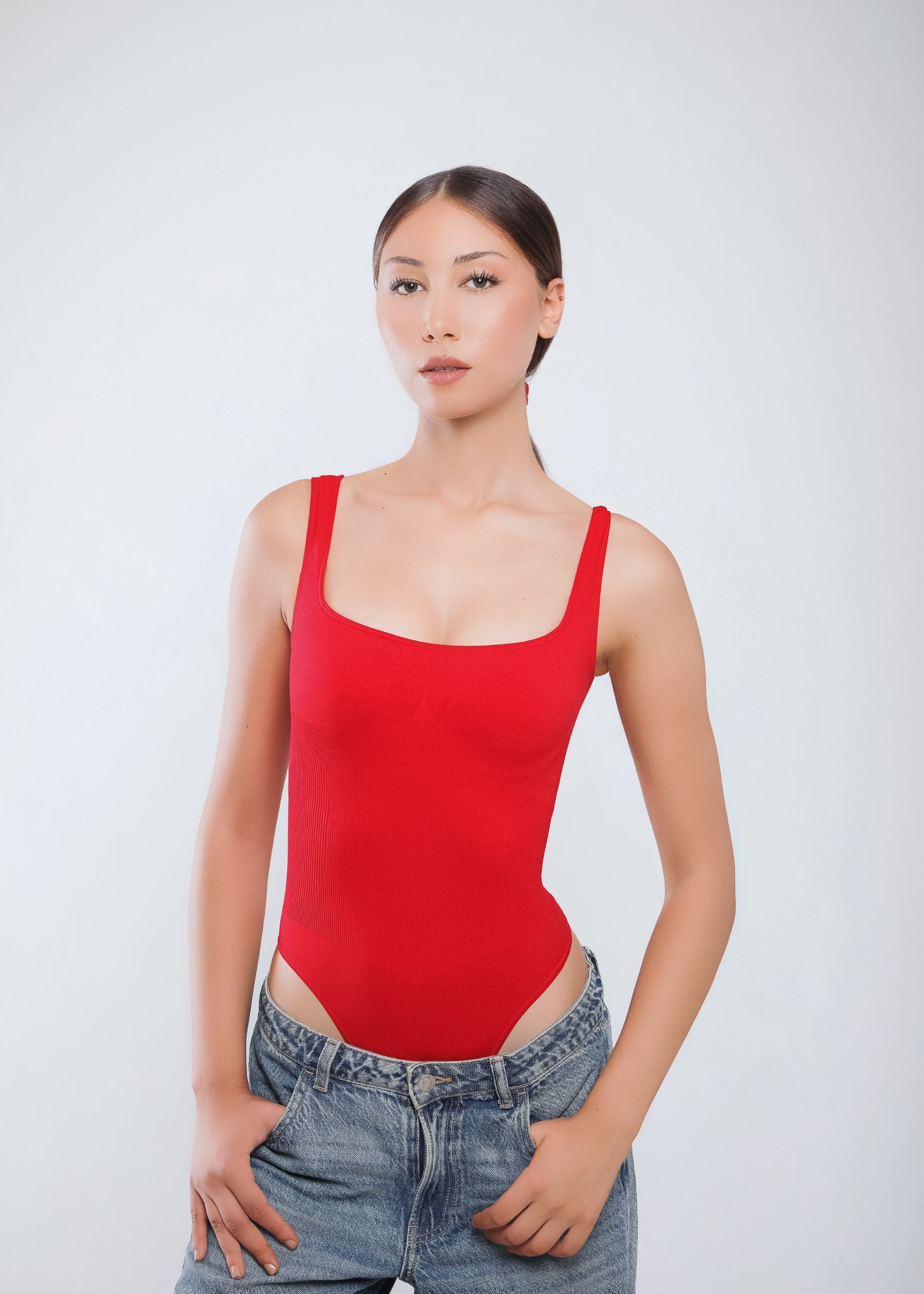 Second Skin Sculpting Thong Bodysuit in True Red, worn front view