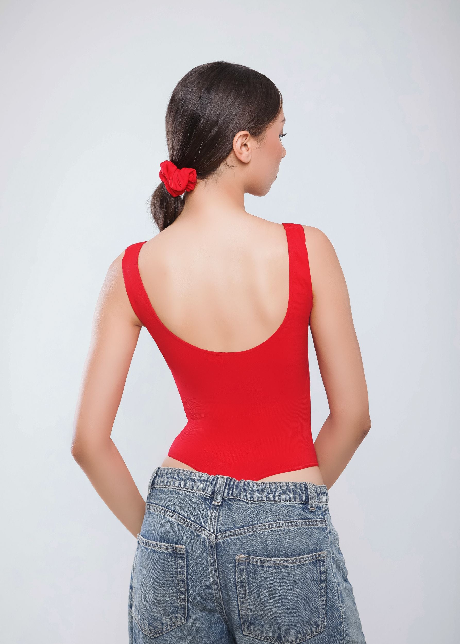 Second Skin Sculpting Thong Bodysuit in True Red, worn back view