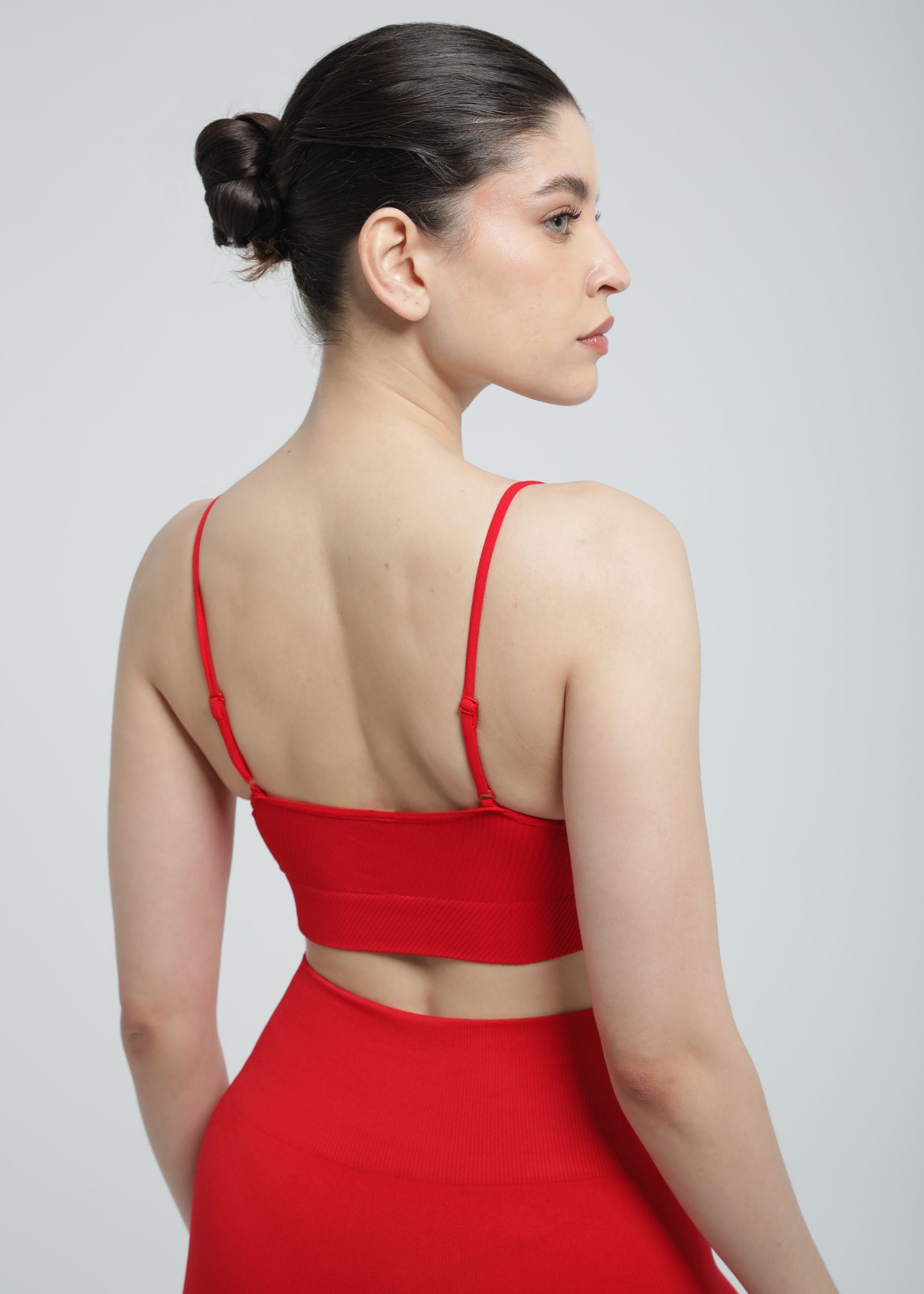 Second Skin Essential Sculpting Bralette in True Red, back view showing smooth supportive design