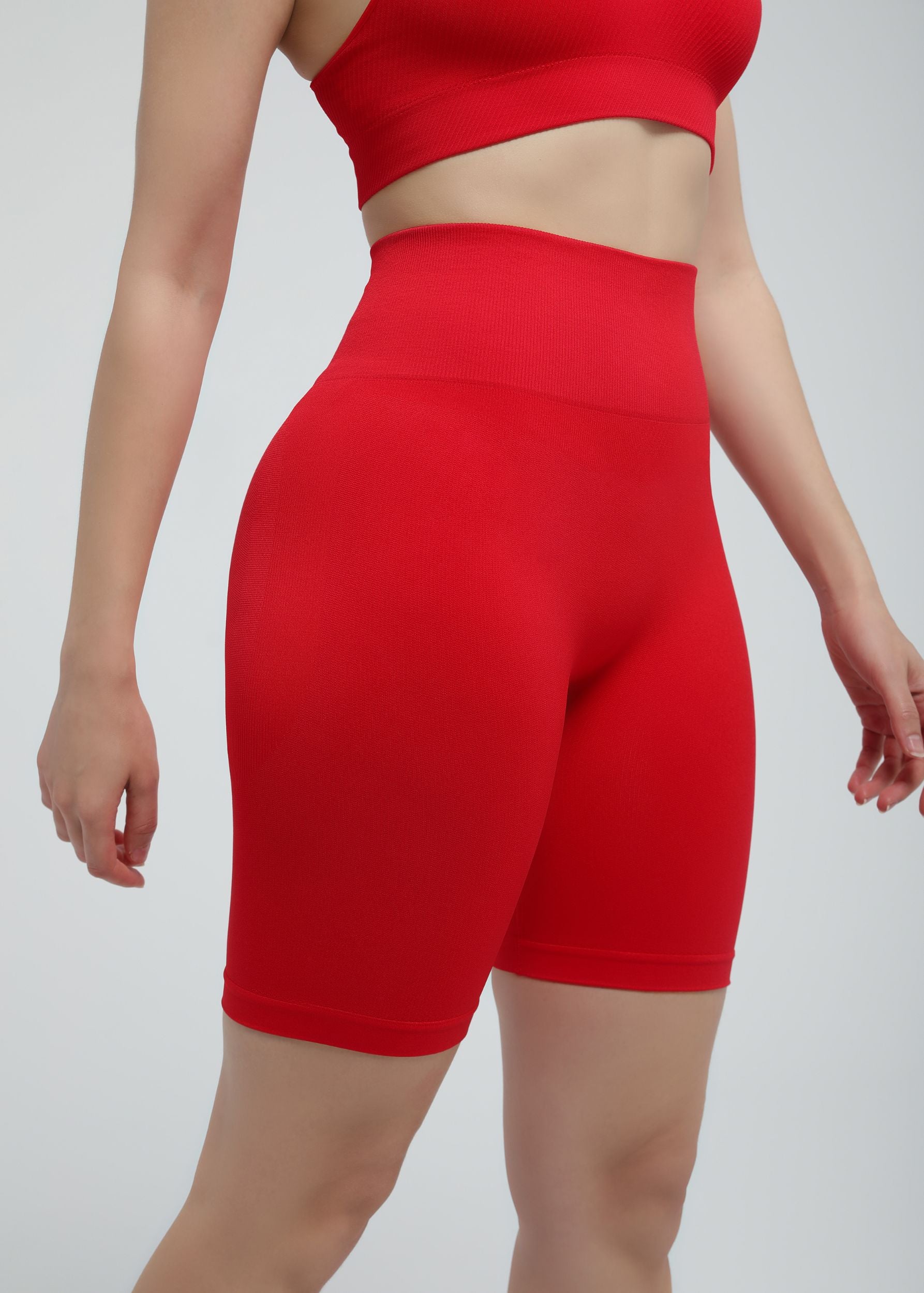 Front angle of true red Second Skin biker short with sculpting waist and seamless construction