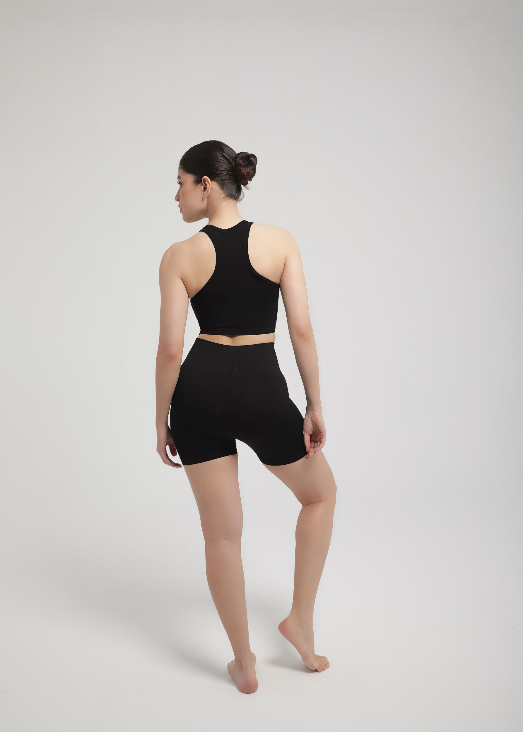 Back view of black sculpting shorts showing high-waist shaping band