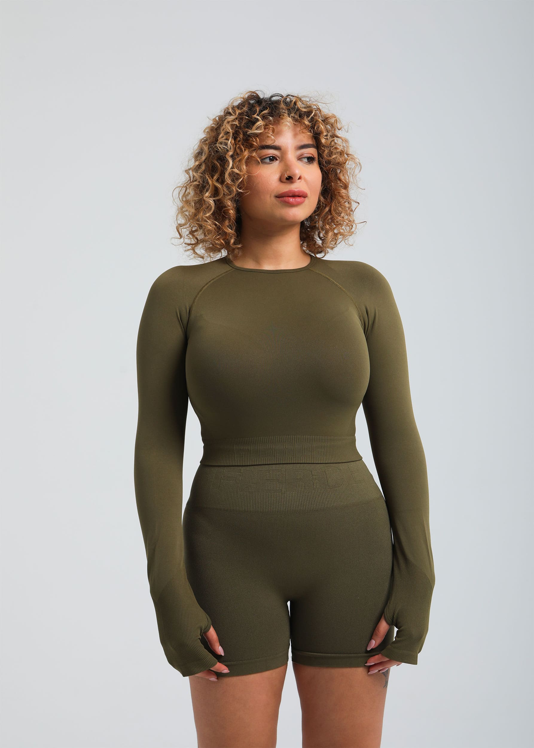 Second Skin long sleeve sculpting crop top in Olive, front view on model