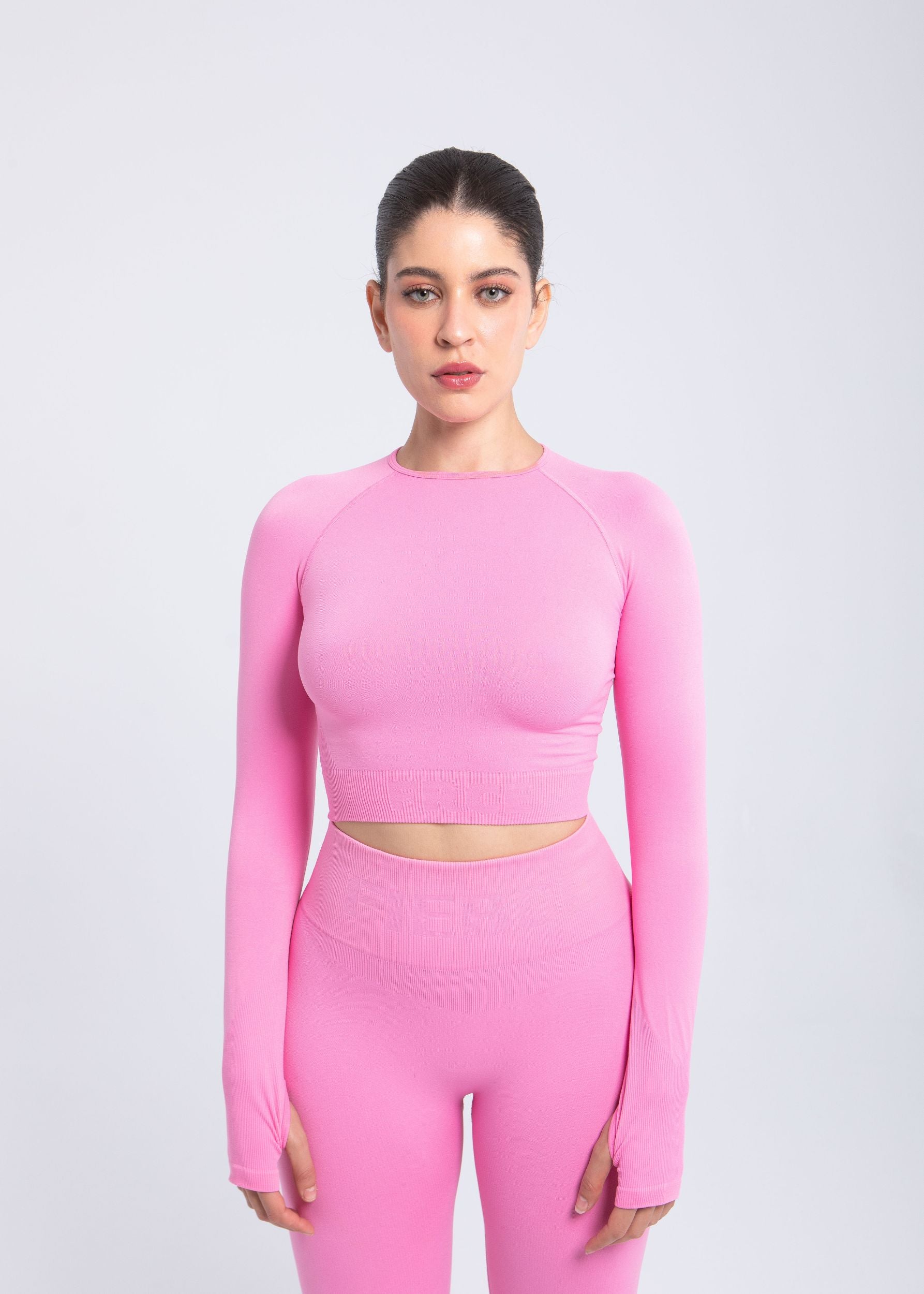 Second Skin long sleeve sculpting crop top in Rose Pink, front view on model