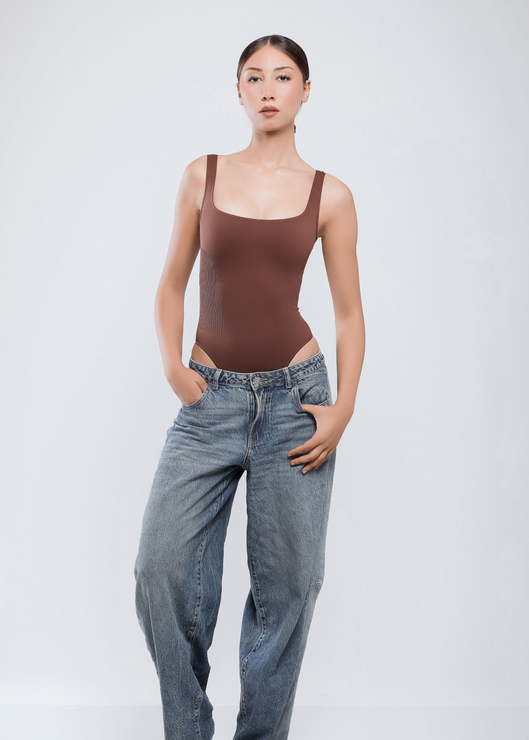 Second Skin Sculpting Thong Bodysuit in Cocoa Brown, worn angled view